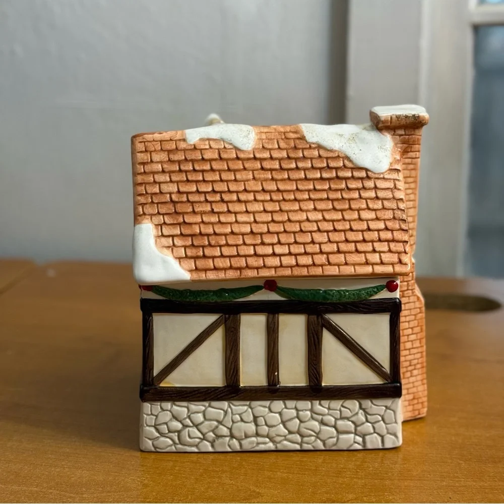 Vintage Christmas cottage cookie jar with people in‎ door